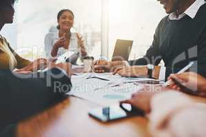 Going all in to achieve another success. a group of businesspeople having a meeting in an office.