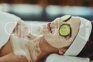 Give your skin all the care it needs. an attractive young woman relaxing on a massage bed at a beauty spa.