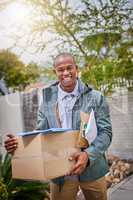 Your delivery is next on my list. Portrait of a courier making a delivery.