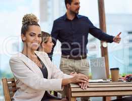 Meetings are an important part of success. Cropped portrait of an attractive young businesswoman sitting in the boardroom during a meeting.