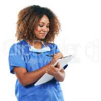 She pays thorough attention to every patient record. Studio shot of an attractive young nurse writing on a clipboard against a white background.