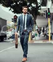 Man with a plan on the move. a handsome young businessman out in the city.