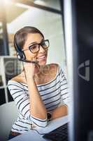 Hi, Im here to help. a young attractive female customer support agent working in the office.