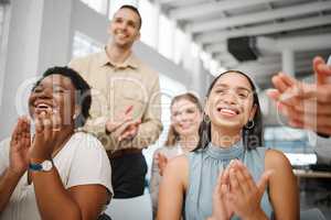 Happy, smiling and excited businesspeople clapping hands, celebrating success and showing motivation in a meeting in an office at work. Colleagues enjoying, expressing agreement and congratulating