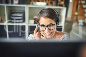 How may I assist you today. a young attractive female customer support agent working in the office.