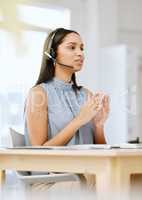 Call center agent, sales advisor and telemarketing employee listening to a client giving them their payment data. Call centre professional giving customer support services about us at her help desk