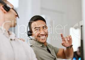 Happy, smiling and laughing call center agent at an insurance company talking to colleague at a help desk. Contact us and our sales customer service support centre and learn about us and thank you