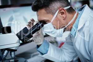 Expert research that helps you live your best life. a mature man using a microscope while conducting pharmaceutical research.