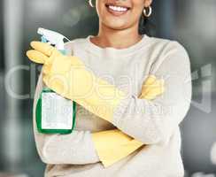 Cleaning, hygiene and chores with a spray bottle in the hands of woman wearing gloves at home. Closeup of housekeeper, cleaner or housewife ready to do housework to keep things neat, tidy and fresh