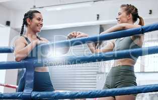 Boxing, success and support with fist bump from friends after cardio workout, competition or fitness training at a gym. Smiling, carefree and excited women giving motivation and unity after exercise