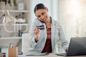 Ecommerce, online shopping and secure banking of happy woman reading credit card while talking on the phone and using laptop. Smiling entrepreneur doing safe financial transaction or transfer payment