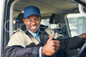 We promise the most reliable service to you. Portrait of a courier showing thumbs up while driving a delivery van.