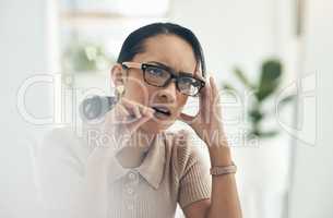 Serious, thinking and confused business woman biting her pen, feeling nervous and trying to solve a problem. Female business professional struggling with mental fatigue while working in her office