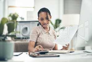 Young, professional and working woman using a calculator to calculate company budget, finances or business expenses. Admin female doing financial planning, banking audit or processing documents.