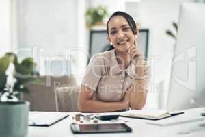 Relaxed young female financial advisor working as an accounting employee or admin portrait. Female work staff counting money and calculating a budget for a department in a company