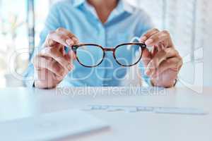 Glasses, eye care and eyewear or optometry eyeglasses for woman with disorders and myopia. Closeup hands of customer buying, purchasing and testing stylish prescription spectacles in clinic and shop