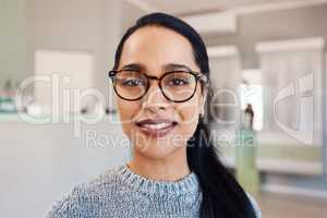 New glasses at optometrist checkup, buying eyewear and fitting frames at a shop. Closeup portrait of the face of female doing eyecare, examining eyesight and standing at optician consultation