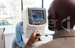 Eye exam by a doctor looking and checking the vision of a patient at a sight specialist office. Medical healthcare screen technology helping an optometrist see retina health and wellness