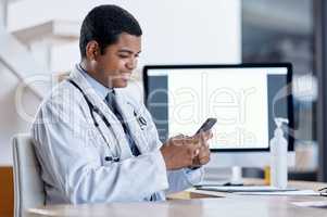 Doctor consulting with an online patient on video call on a phone, doing telemedicine and listening during a medical appointment. Happy, smiling professional worker reading email and checking planner