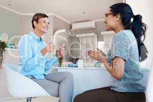 Thumbs up, smiling and mature optometrist happy for patient or client new glasses or spectacles. Young ethnic female celebrating, excited and cheerful for successful eye test for new pair of eyewear.