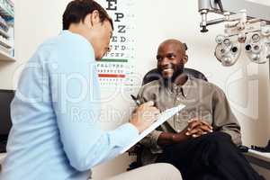 Eye test, exam or screening with an optometrist, optician or ophthalmologists with an ophthalmoscope, testing vision and eyesight. Man getting tested for prescription glasses or contact lenses