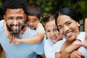 Happy, smiling and loving family taking a selfie enjoying fun moments together in the outdoors. Playful, joyful and caring couple having quality time with their kids on a holiday outside in nature.