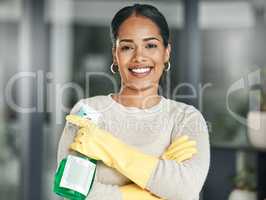 Cleaning, hygiene and chores with a spray bottle while wearing gloves and smiling at home. Portrait of a happy woman, cleaner or housewife ready to do housework to keep things neat, tidy and fresh