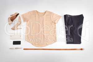 Women, fashion and clothes isolated on a white background in a room. Top view of a stylish, elegant and glamorous costume. Flat lay of trendy female apparel and a womans designer outfit from above.