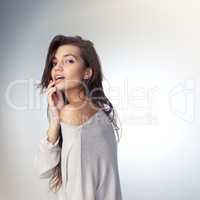 Confidence looks stunning on her. Studio shot of a beautiful young woman posing against a gray background.