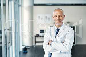 Your wellbeing is my top concern. Portrait of a mature doctor standing in a hospital.