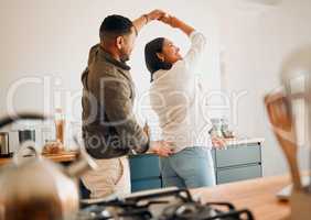 Dancing, romance and playful couple having fun, love and bonding while laughing, spinning and twirling together at home. Loving husband enjoying care, affection and joy while relaxing with happy wife