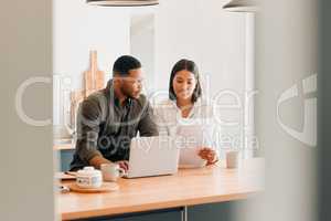 Planning home loan couple with laptop looking at budget, bills or finance paper work confused by the expenses, budget or mortgage. Married man and woman managing utility document or debt online