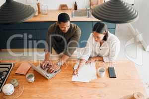 Couple calculating budget, finance and tax while planning investment, loan and bills at home from above. Managing household spending, saving and account to pay money with online banking for insurance