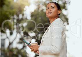 Thinking, motivation and ambition with a young business woman looking to the future with a vision and mission for growth. Female entrepreneur typing on a phone and drinking coffee outside from below