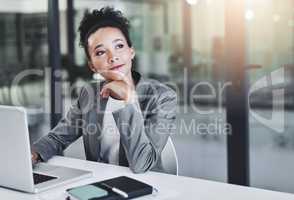Determined to gain success. an attractive young businesswoman in her office.