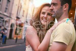 Seeing the city through the eyes of love. a happy young couple sharing an affectionate moment while exploring a foreign city.