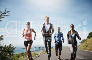 Choose friendships thatll make you happier in life. a group of people out running together.