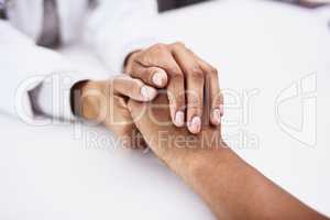 Your health is of the deepest concern to us. Closeup shot of an unrecognizable doctor holding a patients hand in comfort.