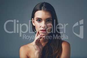 Seriously Whats more beautiful than smooth skin. Studio portrait of a beautiful young woman posing against a blue background.