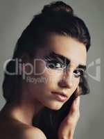 Be unafraid to be yourself. Studio shot of an attractive young woman wearing bold eye makeup.