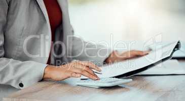 Closeup of auditor, banker and business accountant womans hand calculating, planning and doing financial paperwork. A businesswoman managing investment, medical healthcare and insurance payments