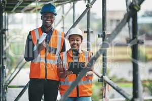 Construction, building and civil engineering team or on site workers with a tablet and plans. Portrait of contractors working as a team feeling happy and ready to engineer and build in the city