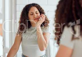 Toothache, oral pain and dental sensitivity for a woman brushing her teeth in the morning. African American female suffering with a painful, hurting or inflammation in her mouth in the bathroom