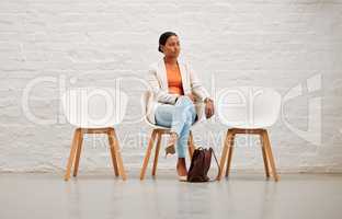 Employment, hiring and recruitment with young woman sitting on a chair waiting for her interview with HR in a creative office. Female shortlist candidate ready for her meeting or appointment