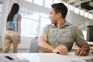Sexual harassment, desire and suggestive business man in a office looking at a woman from behind. Male worker staring with an inappropriate, provocative look at the body of a walking female employee