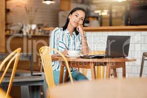 Thinking, wondering and thoughtful female entrepreneur working in a coffee shop planning a mission or vision. Young woman doing remote work in a cafe looking into the distance while writing