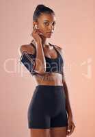 A listening to music, fit and healthy slim woman living a active, wellness and body or weight watching lifestyle. Fitness, training and sports lover ready for workout routine with athletic sportswear