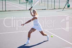 Fitness, balance and sport with athletic tennis player playing competitive match at a tennis court. Female athlete practicing her aim during a game. Lady enjoying active hobby shes passionate about