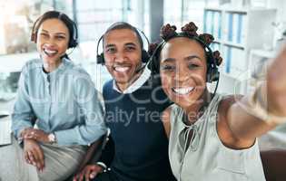 Fun selfie of call center agents, customer service or online support workers and friends in an office. Telemarketing group, team or staff of helpdesk assistants and hotline management people
