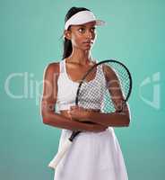 Thinking tennis player, fitness athlete and active woman ready for training with racket in cool fashion and sports uniform while posing on green studio background. Healthy and serious young female